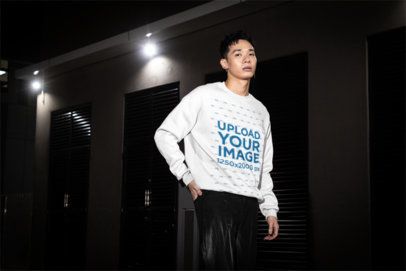 Sweatshirt Mockup Featuring an Alternative-Styled Man Standing on the Sidewalk With a Serious Look m54196