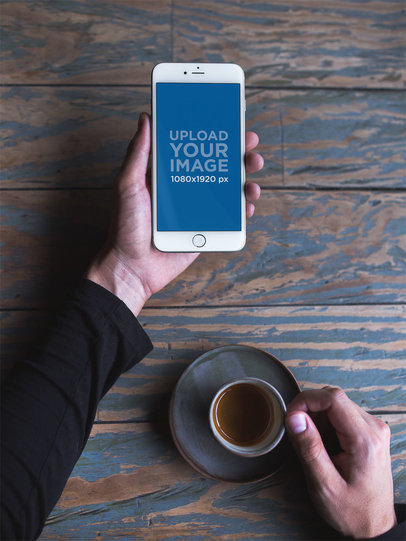 Mockup of a Man Holding a Silver iPhone 8 Plus and an Espresso 21600
