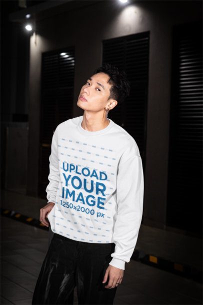 Sweatshirt Mockup of a Serious Man Standing on the Sidewalk With an Alternative Look m54198