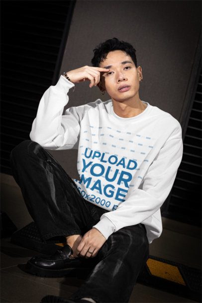 Crewneck Sweatshirt Mockup of a Serious Man Sitting on the Sidewalk m54200