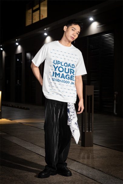 Oversized Round-Neck Tee Mockup of a Man With a Serious Look Posing in the Street m54192