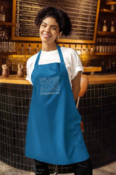 Mockup of a Happy Woman Wearing an Apron in a Bar Counter m58073