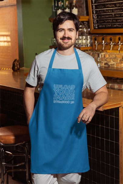 Apron Mockup Featuring a Smiling Bearded Man Posing in a Bar m58072