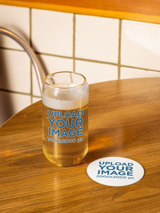 Mockup Featuring a Coaster and a Beer Can Glass Placed on a Wooden Table