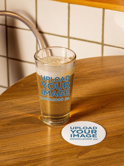 Shaker Pint Beer Glass Mockup Featuring a Coaster Placed on a Table m58064