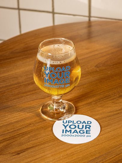 Coaster Mockup Featuring a Tulip Glass Filled With Beer m58063