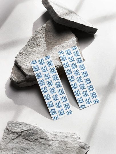 Mockup of Two Tickets Lying Over a Rock m58153