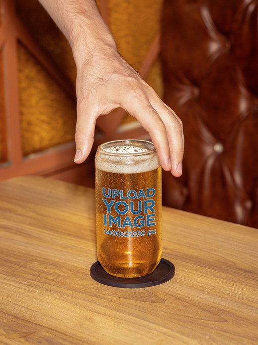 Mockup of a Man's Hand Reaching a Can Glass Filled With Beer