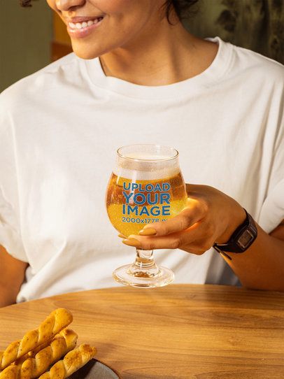 Mockup Featuring a Smiling Cropped-Face Woman Holding a Tulip Glass Filled With Beer m58067
