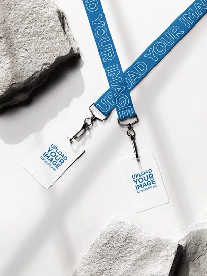 Lanyard Mockup of Two Badge Holders Lying on a Surface With a Rock m58152
