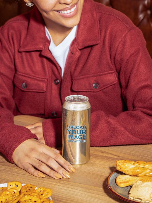 Beer Can Mockup Featuring a Happy Cropped-Face Woman in a Restaurant