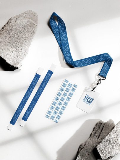 Mockup of a Ticket Lying on a Surface With Two Wristbands and a Lanyard With a Badge Holder m58151