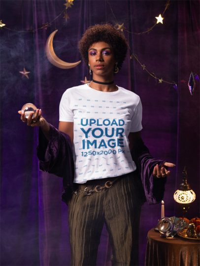 Bella Canvas T-Shirt Mockup of a Woman in an Esoteric-Styled Outfit Holding a Crystal Ball m58306