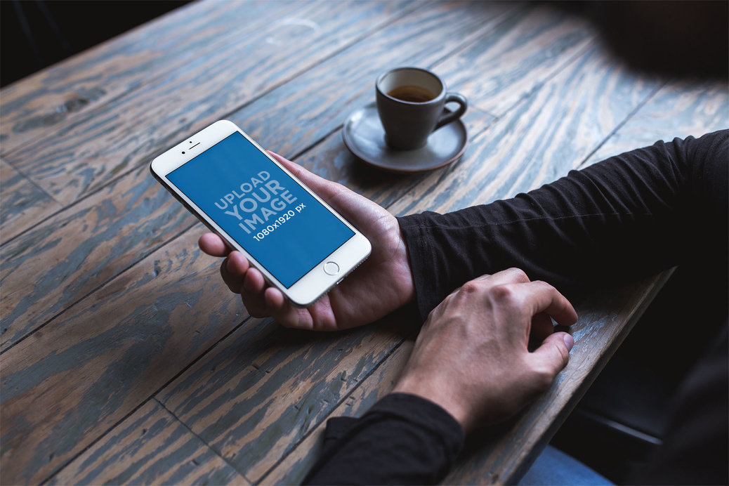 Mockup of an iPhone 8 Plus Being Used at a Cafe