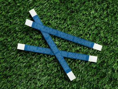 Mockup of Three Wristbands Lying on a Grass Surface m58163