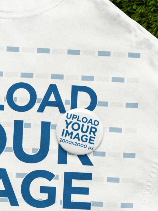 Placeit - Oversized T-Shirt Mockup Featuring a Pin Button and a Grass ...