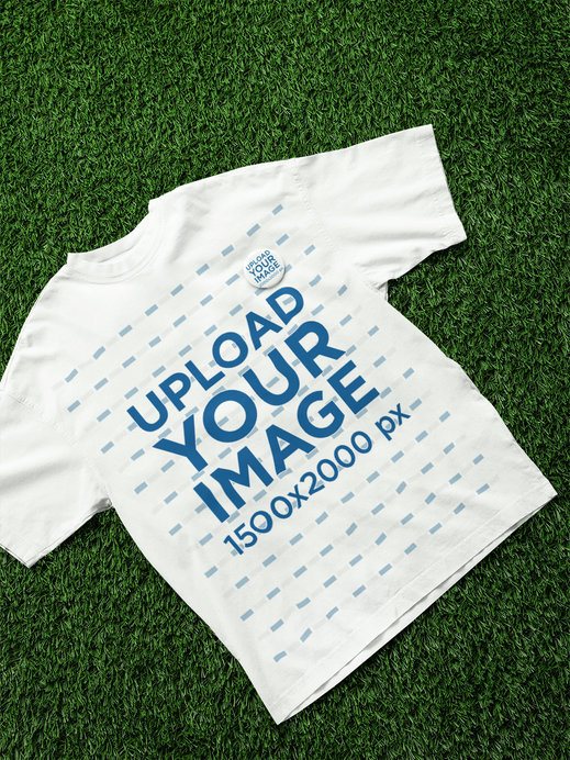Oversized T-Shirt Mockup Featuring a Pin and a Botanical-Themed Background
