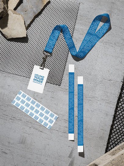 Mockup of a Badge With a Lanyard Lying on the Street With Two Wristbands and Two Tickets m58167