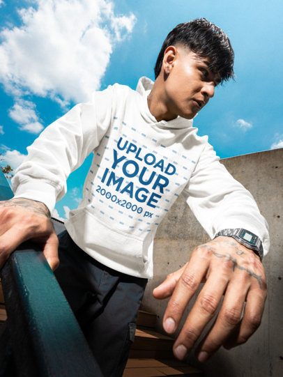 Comfort Colors Hoodie Mockup Featuring a Tattooed Man Going Downstairs in a Stadium m57616