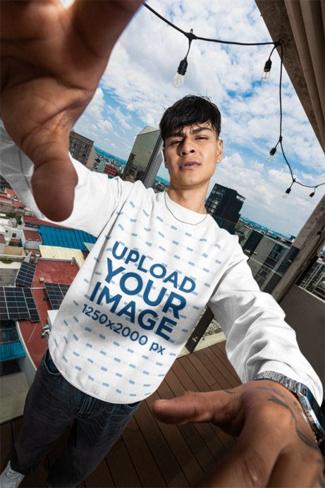 Comfort Colors Sweatshirt Mockup Featuring a Man Taking a Selfie From a Roof