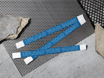 Mockup of Three Wristbands Lying on the Street Floor m58170