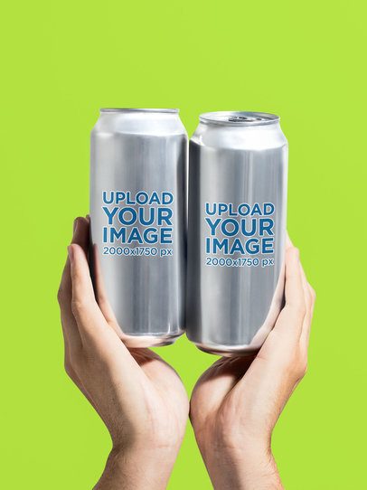Mockup of a Person Holding Two 16 Oz Cans in a Studio m58416