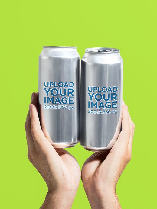 Mockup of a Person Holding Two 16 Oz Cans in a Studio