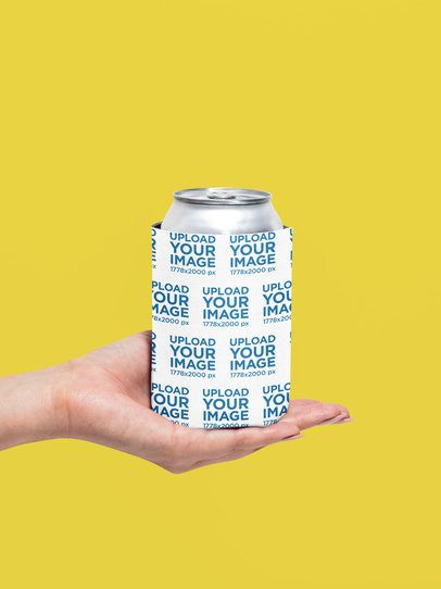 Mockup Featuring a Woman Holding a Koozie With Her Palm in a Studio