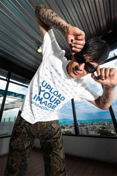 Comfort Colors T-Shirt Mockup of a Tattooed Man Posing on a Rooftop With Sunglasses m57604