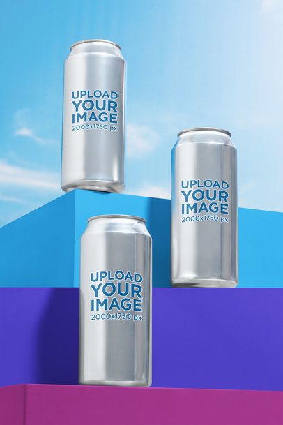 Mockup Featuring Three Cans Placed on Colorful Platforms Against the Sky