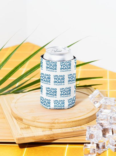 Mockup of a Koozie Placed on a Wooden Surface With Some Ice in a Tropical Setting