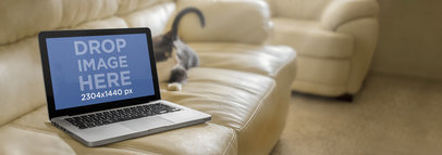 Mockup Template of a Macbook Pro on White Leather Couch 