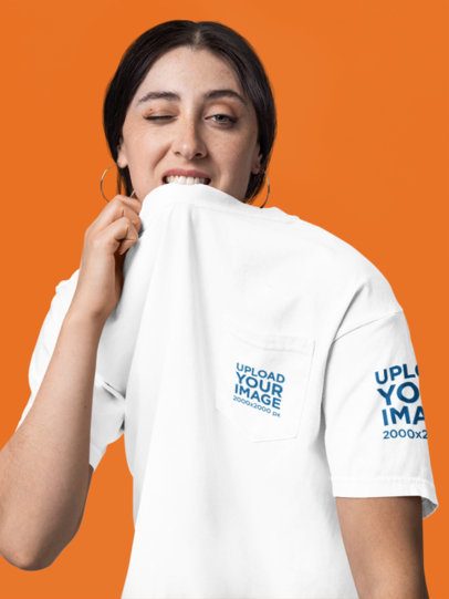Comfort Colors Mockup Featuring a Woman Biting Her Pocket T-Shirt in a Studio