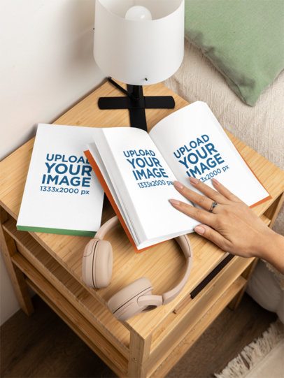 Mockup of a Woman Opening a Book in a Wooden Nightstand