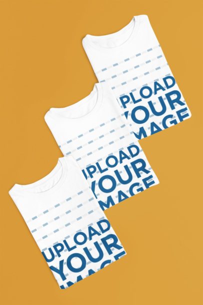 Bella Canvas Mockup Featuring Three Folded Round-Neck Tees Lying on a Surface