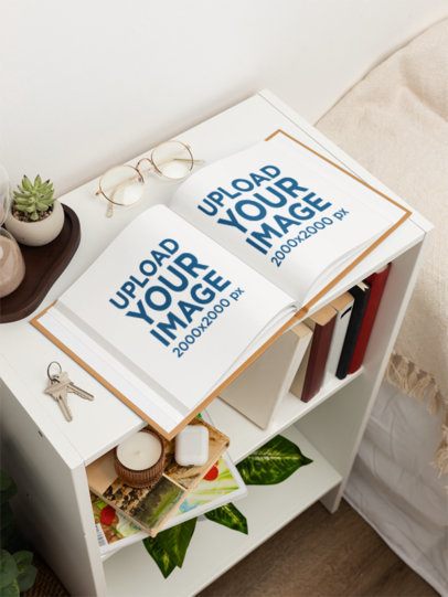 Mockup of an Open Book Placed in a Bookshelf in a Nice Bedroom