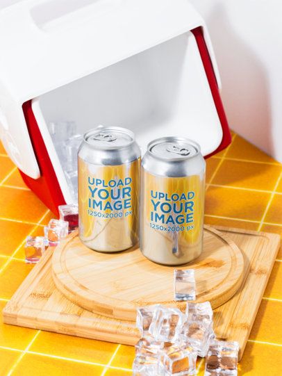 Mockup of Two Cans Placed on a Wooden Surface and Surrounded By Ice Cubes
