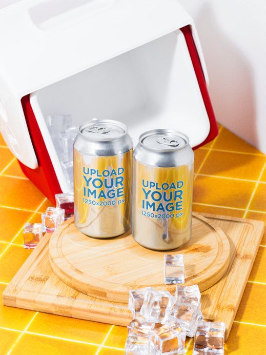 Mockup of Two Cans Placed on a Wooden Surface and Surrounded By Ice Cubes