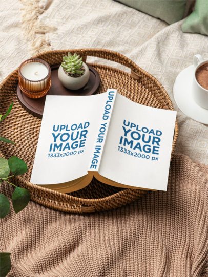 Mockup of a Paperback Book Placed on a Cozy Spot in a Bed