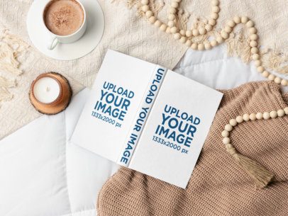 Mockup of a Hardcover Book Lying on a Comfy Bed