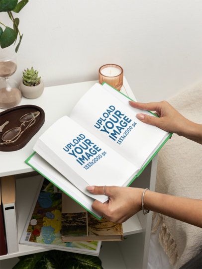 Mockup of a Woman Opening a Book Near a Nightstand