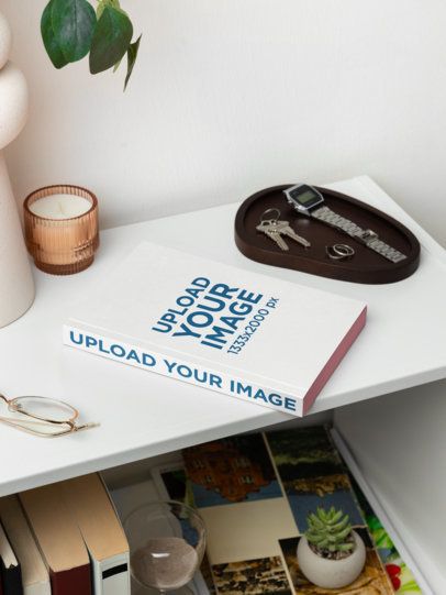 Mockup of a Paperback Book Placed on a Nightstand With a Candle m58562