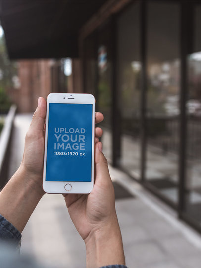 Gold iPhone 8 Plus Mockup Featuring a Blurry Building a21602