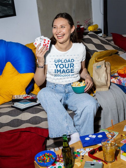 Bella Canvas Crop Top Mockup of a Happy Woman With Popcorn and Playing Cards
