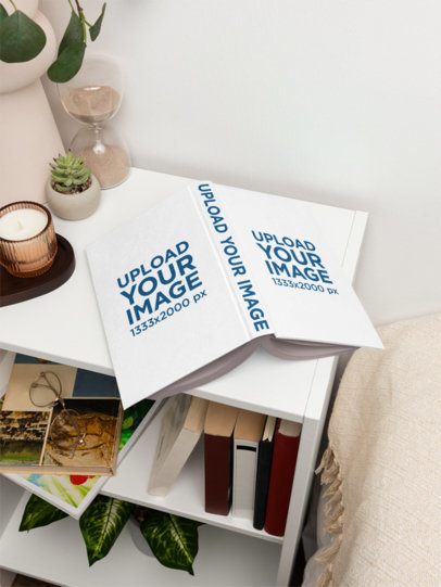 Hardcover Book Mockup Featuring a Nightstand Next to a Bed