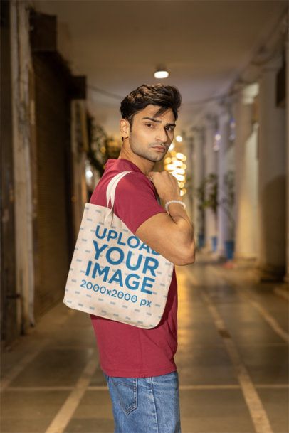 Mockup Featuring a Man With a Serious Look Carrying a Tote Bag