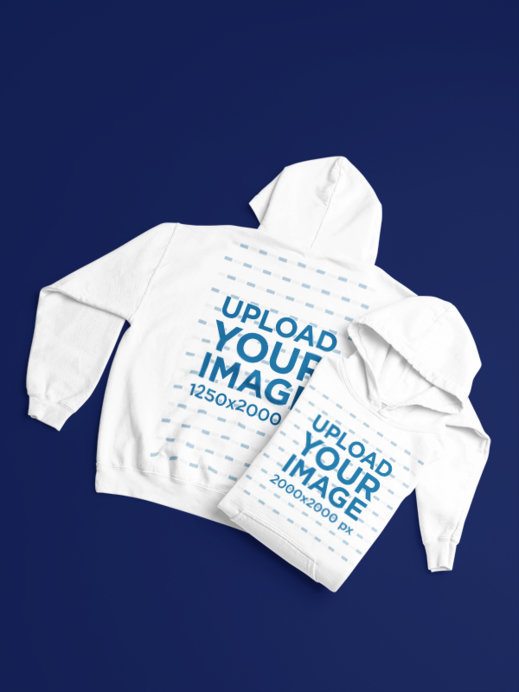 Gildan Mockup Featuring Two Pullover Hoodies Lying on a Customizable Setting