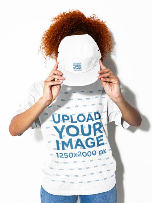 Oversized T-Shirt Mockup Featuring a Woman Hiding Her Face Behind a Yupoong 7005 Panel Cap