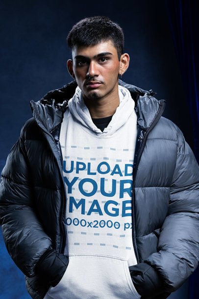 Comfort Colors 1567 Mockup Featuring a Man in a Pullover Hoodie and a Winter-Themed Style m59239