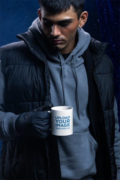 Winter-Themed Mockup of a Man Posing With a Sublimated Coffee Mug m59236
